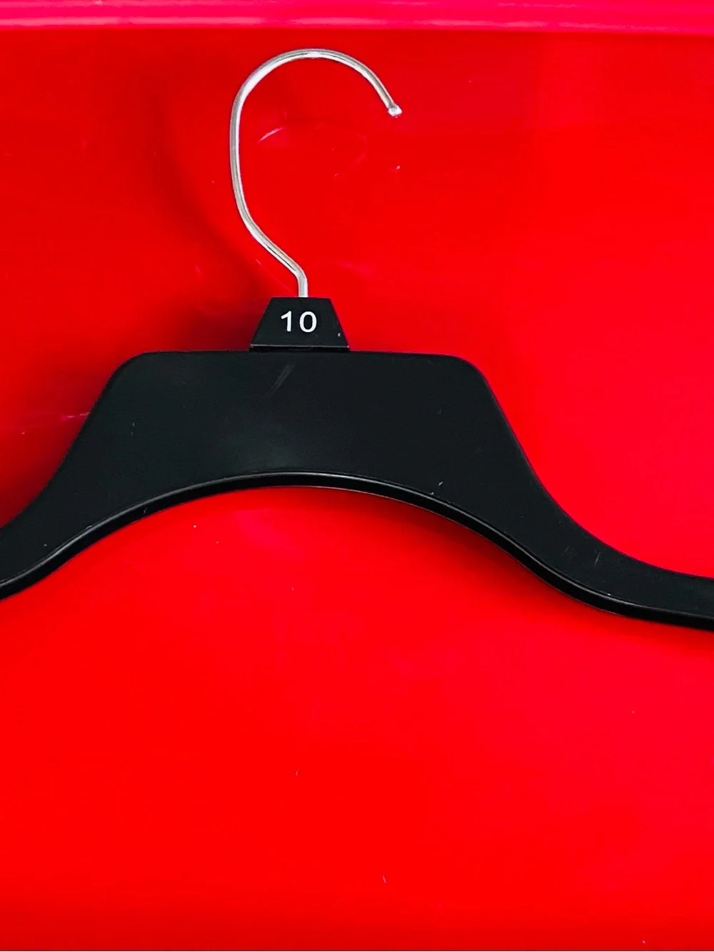 Jennifer Lopez Black Wooden Hanger with Size Tag